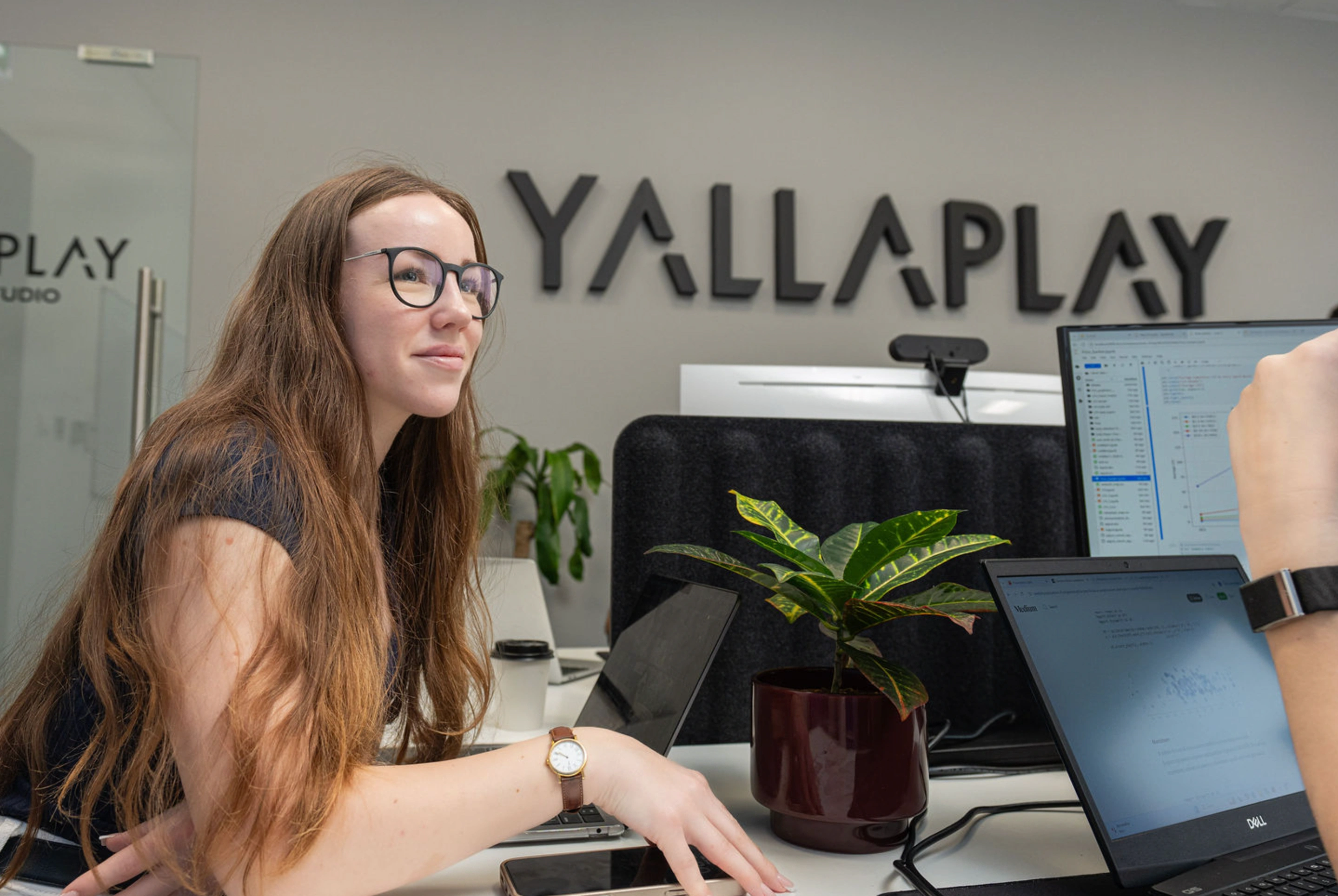 YallaPlay team member at their desk
