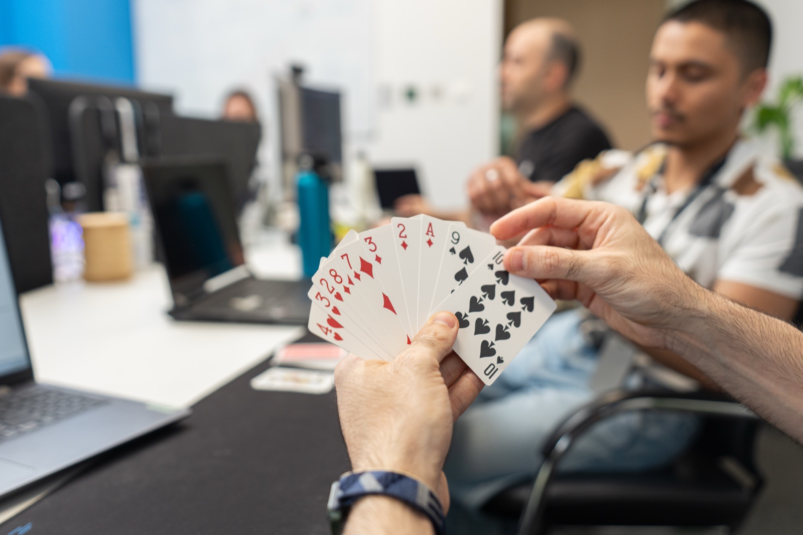 YallaPlay teammates playtesting a card game in the office