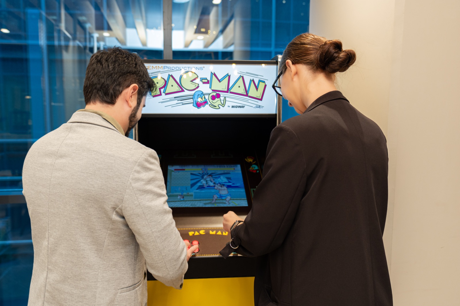 YallaPlay teammates playing an arcade game together