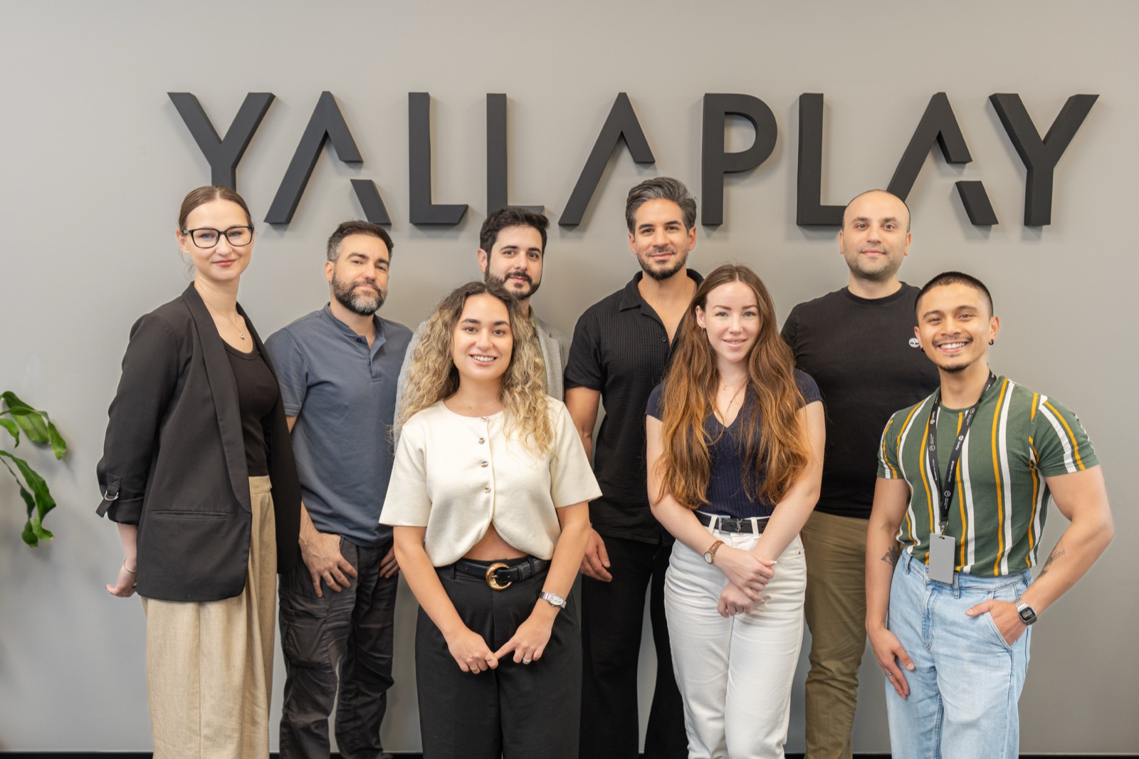 The YallaPlay team together in front of the studio logo